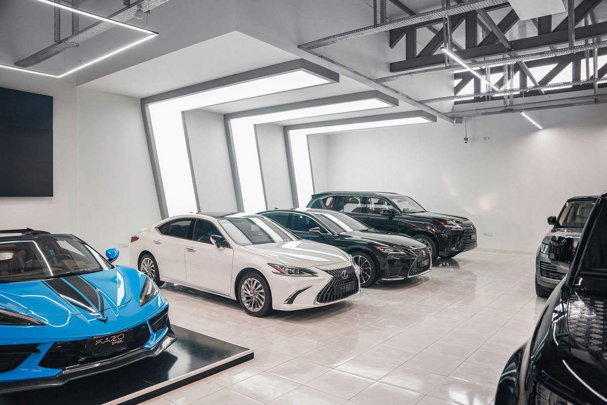 New cars lined up in a bright showroom